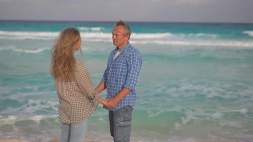 Romantic Middleaged Couple Enjoying a Peaceful Evening Together on the Beach Love Connection and