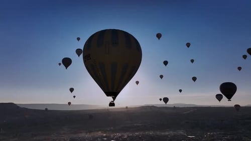 Hot Air Balloons Fly Over Cappadocia at Sunrise