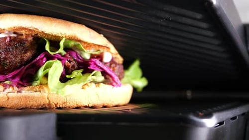 Juicy Veggie Burger on a Grill Close Up