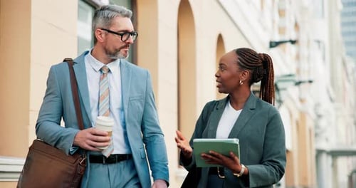 Professionals Walking and Talking in City