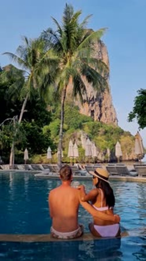 Couple of Men and Women at a Swimming Pool of a Luxury Resort in Thailand