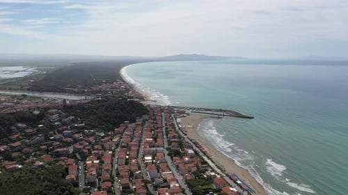 Aerial view of the coastline and pier, Italy.