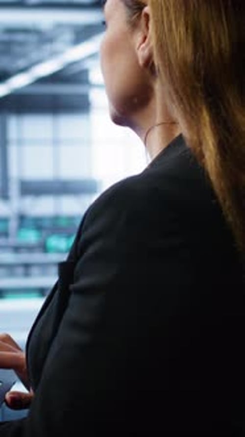 Vertical Video Technician Doing Checkup Inputting Data on Laptop of Needed Server Hub Fixes