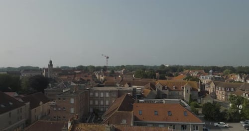 Aerial view of fort city with rooftops and river, France.