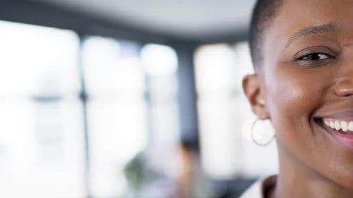 Portrait of smiling african american businesswoman in office, slow motion, copy space
