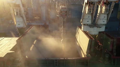 Aerial View Fom Above Wheat Loading to Bulker Ship Cargo Hold at Sea Grain Elevator in Sea Port