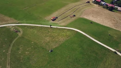 Tractors Harvesting Crops in a Rural Field
