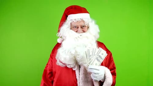 Santa Claus with Money on Green Screen