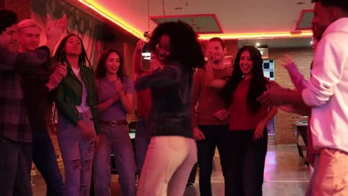 Friends Dancing and Partying at an Urban Bar