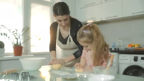 Hands on Family Fun Mixing Dough for Homemade Cookies Together