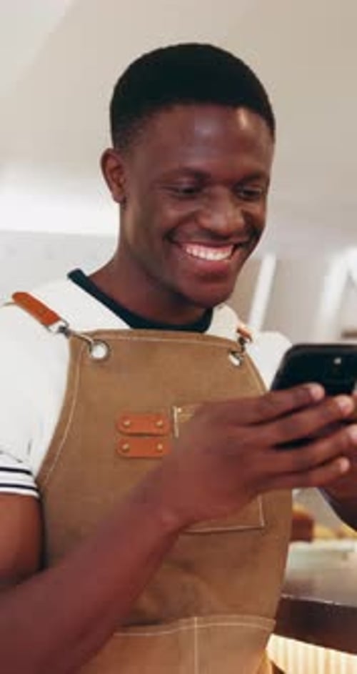 Phone, cafe barista and man typing, check schedule or sales information for stock
