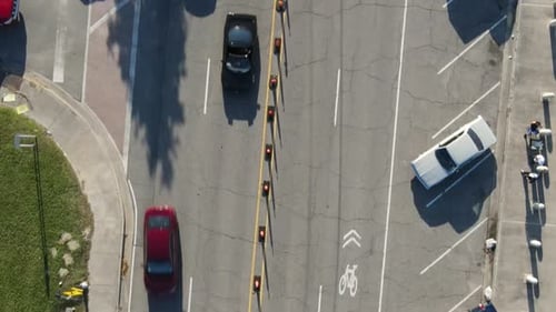 Top View Of Asphalt Car Parking Area With Cars Driving. aerial