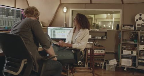 Musicians Composing Song in Music Recording Studio