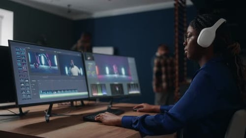 Female Film Editor Processing Video Clip in Studio Montage and Color Grading Postproduction