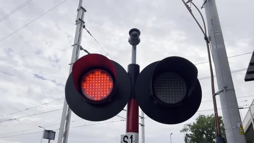 A Close Up of a Red Traffic Light on a Pole