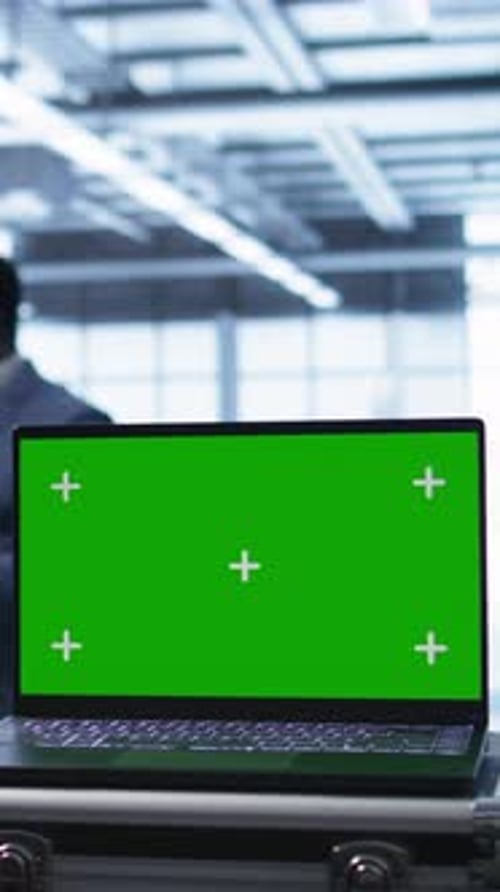 Vertical Video Green Screen Laptop Used By Engineers Monitoring Server Room