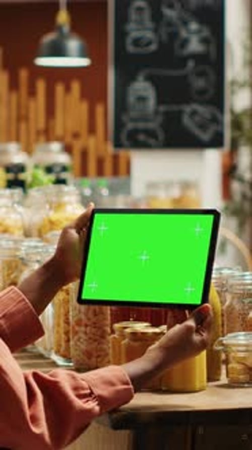 Vertical Video African American Woman Uses Greenscreen on Tablet in Supermarket