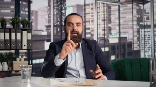 Bearded Man Talking in an Office Setting