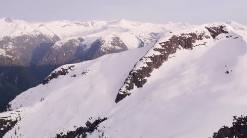 British Columbia, Canada Circa-2018. Aerial View of Snow Covered Mountain Range