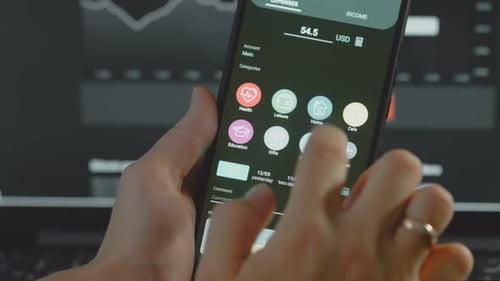 Smart Money Management Using Technology to Track Budget A Person Who Uses a Cell Phone to Do Their
