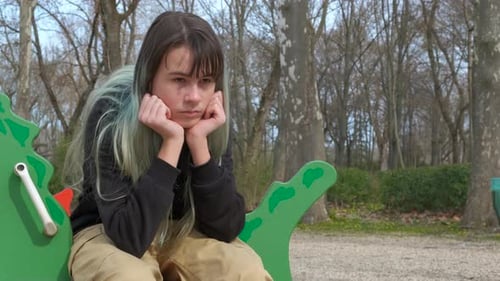 Feel Depressed on Carousel on Empty Playground