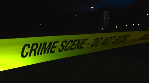 Crime Scene Tape Blocking Entry at Night