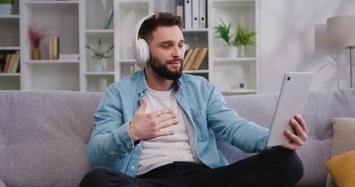 Bearded Man Wear Headset Talking by Video Call, Involved at Stream Online Communication, Using video