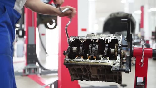 Auto Mechanic Disassembles Car Engine in Workshop Technician Removes Crankshaft Bearings in Garage