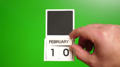 Hand Changes February 10th Date on Wooden Calendar