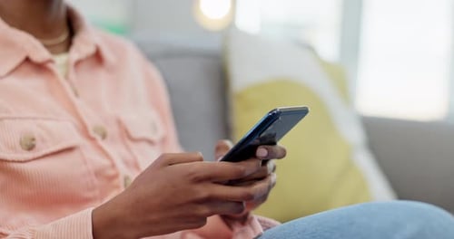 Young Adult Using Smart Phone at Home