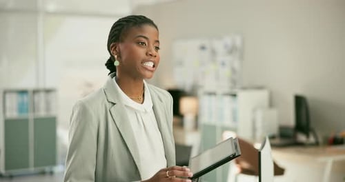 Woman Using Tablet in Modern Office Setting