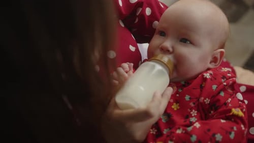 Infant Feeding with Bottle in Gentle Indoor Setting