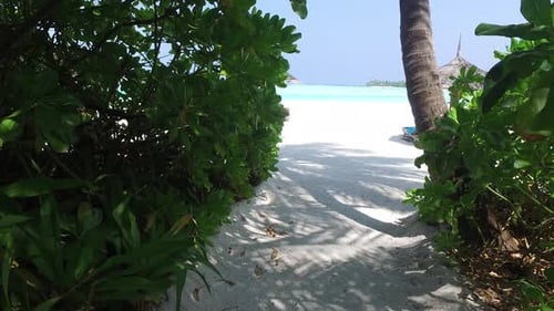 Maldives beach access pathway to turquoise waters and summer sunbeds vacation