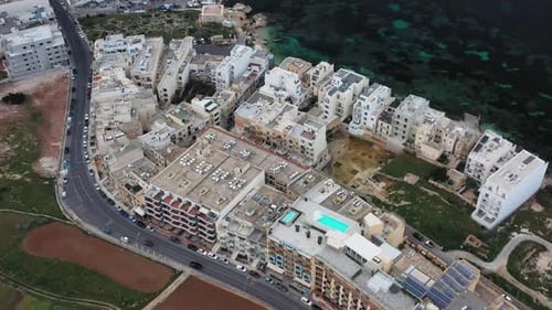 Aerial view of Mellieha buildings near the sea, Malta.