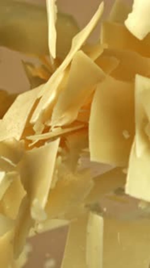 Super Slow Motion Parmesan Cheese on a Light Background Filmed on a Highspeed Camera at 1000 Fps