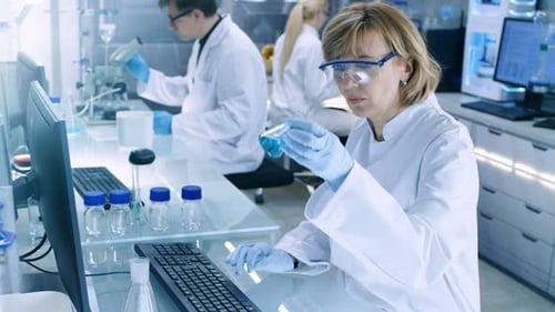Scientist working in a lab using computer