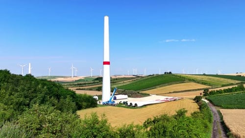 Tower Of Wind Turbine At The Construction Site - Wind Energy. - aerial shot