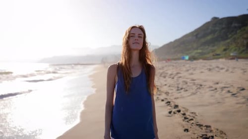 Attractive Woman Walking on the Beach
