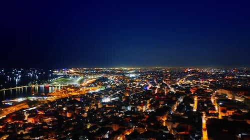 Footage over the urban area of Istanbul lit with street lights. View on Turkey capital at night.