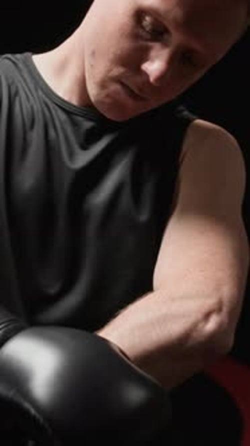 Man Wearing Boxing Gloves Practicing Punches