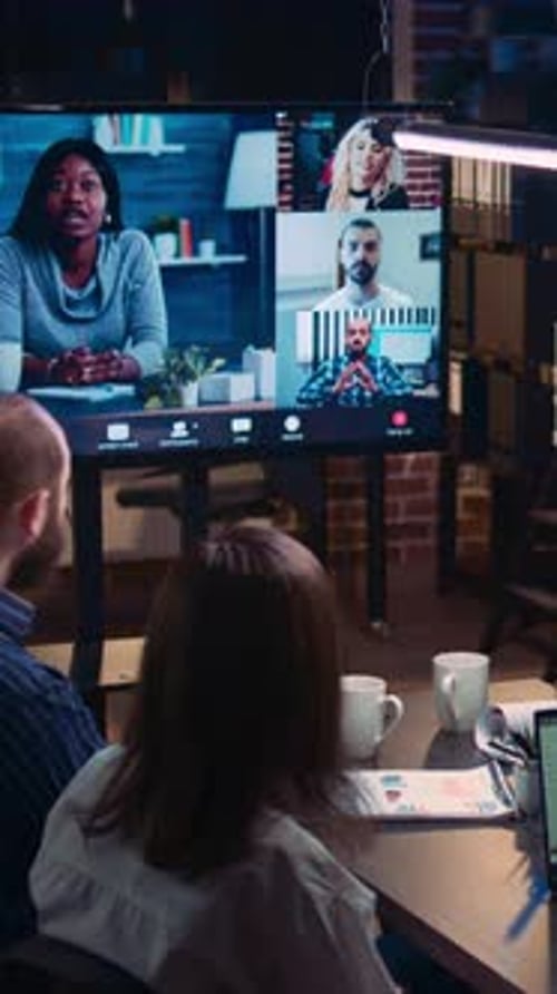 Coworkers Attending a Virtual Meeting in Office