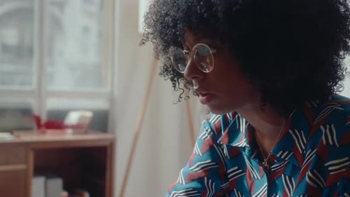 Woman in Glasses with Curly Hair