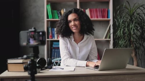 Woman Vlogging While Working on Laptop at Home