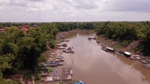 Redundant vessels lying inactive due to lack of fish in the rivers of South East Asia.