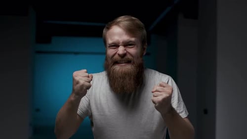 Excited Man Celebrates Success Indoors Close Up