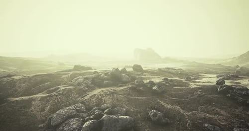 Vast Rocky Landscape Shrouded in Mist Reveals Natures Wild Beauty