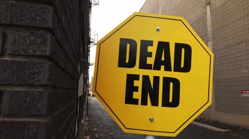 Dolly Motion Left and Right in Front of Alleyway Dead End Sign