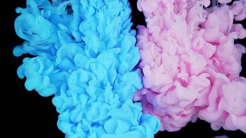 Swirling Light Blue and Pink Ink on Black