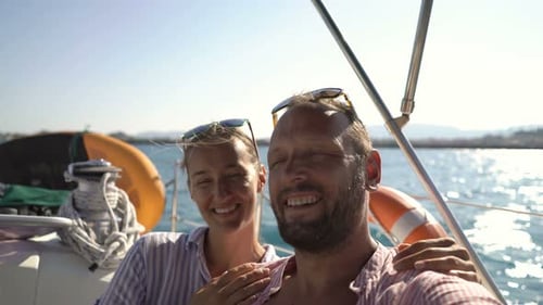 Happy Couple Taking Selfie Photos While Sailing Boat on Ocean Adventure