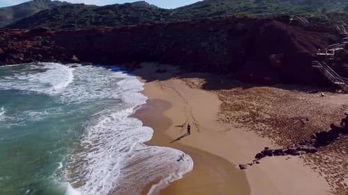Rocky clifftops with big surf below along the coast